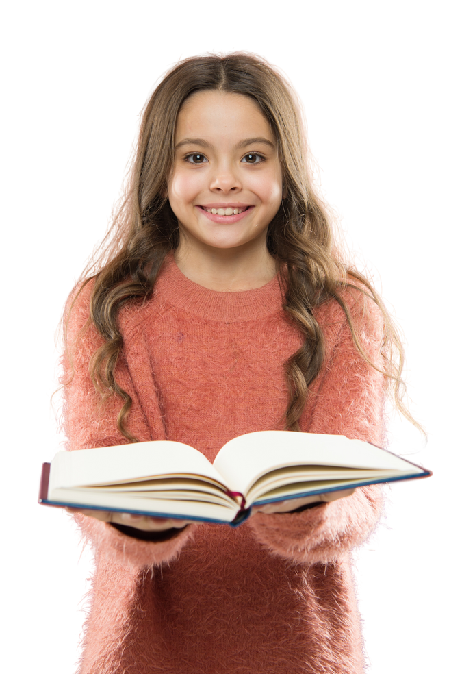 a smiling child holding an open book